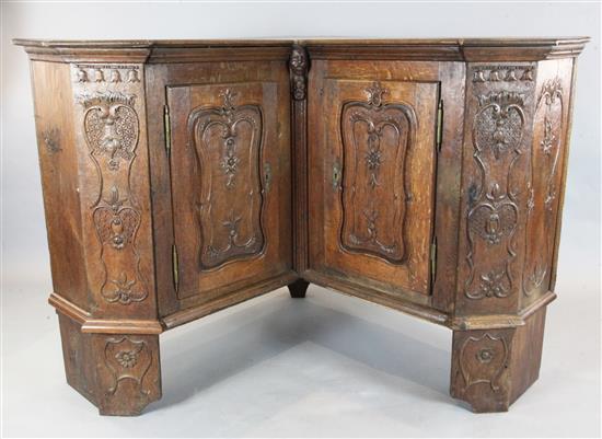 An 18th century French oak corner armoire, W.5ft 8in. D.1ft 10in. H.3ft 9in.